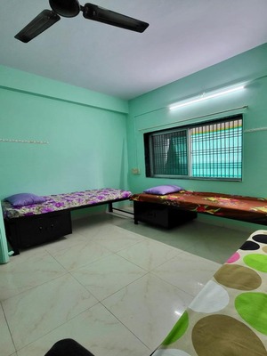 Spacious twin sharing room with beds and storage